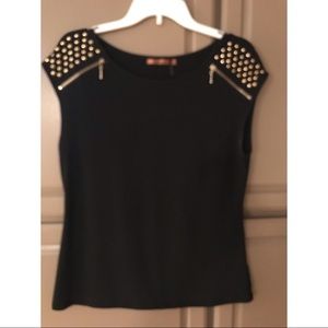 Top with gold accents. Like new.